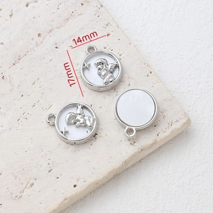 Macro detail of 14mm silver alloy angel relief charms for DIY jewelry making