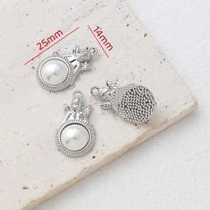 Detailed view of silver angel star pendants with pearls and 25mm measurement