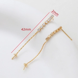 Macro view of 18k gold plated linear earring findings with 42mm length and cubic zirconia