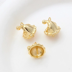Detail of 14k gold plated Christmas hat jewelry charm with cat paw engraving and pin