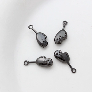 Set of four glossy black organic heart-shaped charms for DIY jewelry making