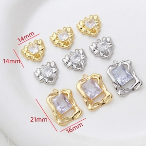 Detail view of heart and rectangle zircon pendants with 14mm and 21mm size measurements