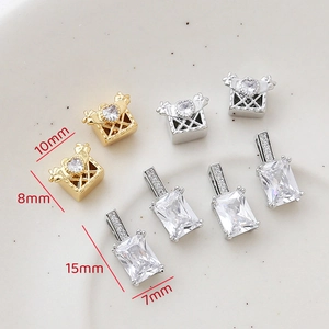 Detail of 14k gold plated gift box and emerald cut zircon pendants with dimensions