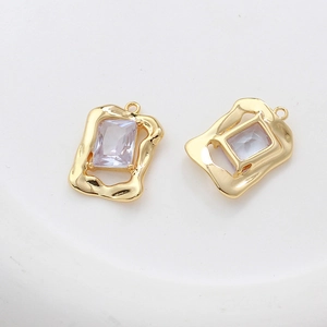 Close-up of 14k gold-plated heart-shaped pendant with rectangular zircon for DIY jewelry