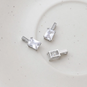 Detail of silver rectangular zircon pendant showing front and hollow back structure