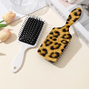 Spazzola per capelli leopardata e bianca con cuscinetto d'aria per massaggio e districante