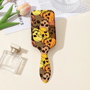 Detail of artistic skull pattern air cushion hairbrush on a stylish dressing table