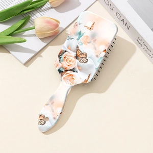 Brosse à cheveux pneumatique avec motif vintage de roses et de papillons colorés