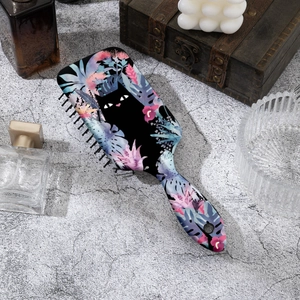 Detangling air cushion hairbrush with cute black cat and floral print on grey stone