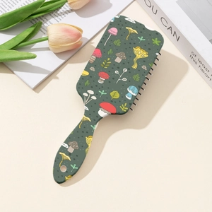 Spazzola per capelli verde scuro con stampa funghi colorati e manico ergonomico