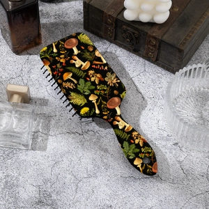 Vintage mushroom print hair cushion brush on an elegant grey stone background