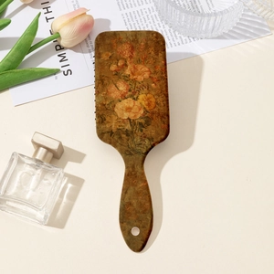 Vintage floral hairbrush with cushion bristles on a minimalist aesthetic background