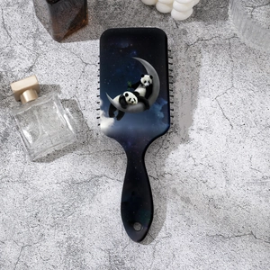 Detail of panda print on moon and starry sky air cushion massage hair brush back