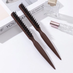 Three-row boar bristle teasing hairbrushes with pointed tail handles on white background