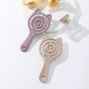 Pastel cat-ear spiral hair brushes in purple and beige on a minimalist vanity display