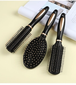 Detailed set of black and gold hairbrushes including round, paddle, and massage styles