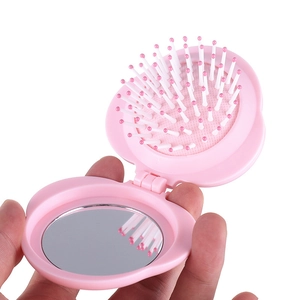 Pink flower-shaped folding hairbrush with mirror and air cushion bristles