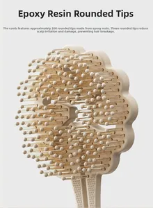 Detail of flower-shaped mini detangling brush with 200 rounded resin massage bristles