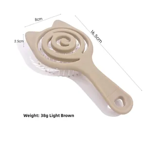 Detailed view of cat-ear hollow hairbrush in light brown with specific dimensions