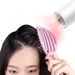 Brosse à cheveux rose ajourée au design incurvé pour un séchage rapide et massage