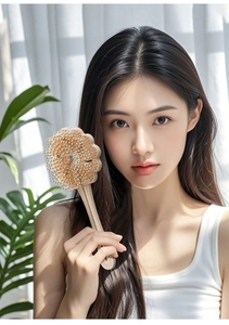 Detailed view of cloud-shaped massage hairbrush with anti-slip handle and soft rounded pins