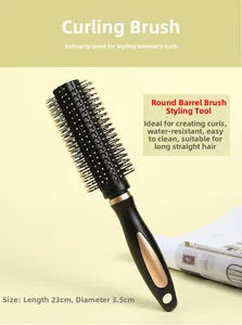 Close-up of black and gold round hairbrush with ergonomic handle for hair styling