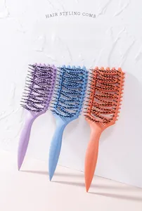 Three-piece hollow hair styling comb set in pastel purple, blue, and coral orange colors