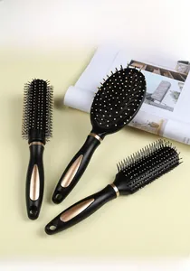 Three-piece hair brush set with black rose gold vent, round and paddle brushes