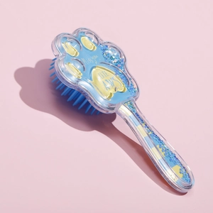 Detail of cat paw hairbrush with blue glitter sand and CUTE PAWS printing
