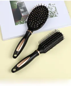 Detail of professional black and gold hairbrush set with air cushion and vent brush
