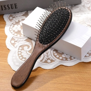 Portable wooden hair brush with metal pins and air cushion for scalp massage