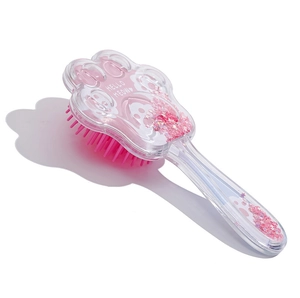 Pink cat paw heart hair brush with flowy stars and Hello Meow text on white background