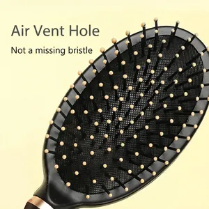 Classic black air cushion massage hairbrush with rose gold detail and ventilation hole