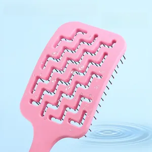 Pink curved vent brush with hollow back design for scalp massage and wet hair