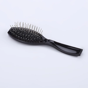 Oval hair brush with stainless steel pins and ergonomic black handle for scalp massage