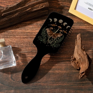 Air cushion hairbrush with vintage lunar moth and forest mushroom print on dark wood