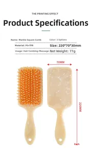 Detail view of marble patterned square hairbrush with PS+TPR material specifications