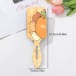 Détail de la brosse Capybara avec dimensions 21,5x7cm et coussin d'air massant intégré
