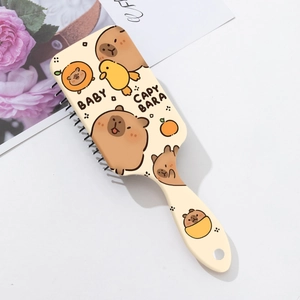 Détail de la brosse à cheveux Capybara avec coussin d'air et motifs de canard mignons