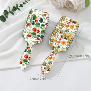 Strawberry and orange floral air cushion hairbrush set with dimensions 21.5cm by 7cm