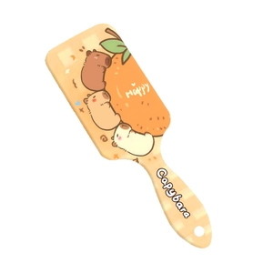 Brosse à cheveux Capybara avec motif damier orange et coussin d'air massant