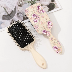Floral paddle hairbrush set with scalp massage bristles and eco-friendly beige design