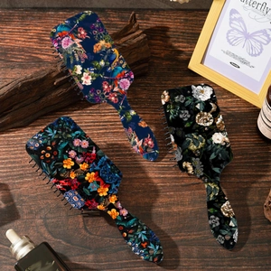 Three-piece vintage floral air cushion hairbrushes with tropical bird and botanical prints