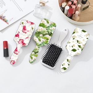 Floral air cushion massage hairbrushes for women with ergonomic handles and printed patterns