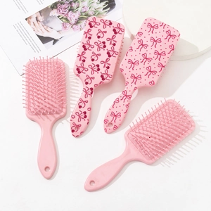 Pink detangling hair brush set with cute cherry and bow prints for smooth styling