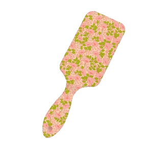 Pink floral print hair cushion brush with massaging bristles for smooth hair styling