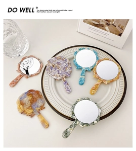 Detailed view of colorful rose-shaped acetate hand mirrors with marble texture