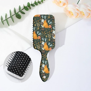 Detail of bohemian floral print cushion hairbrush with cartoon birds and soft massage bristles