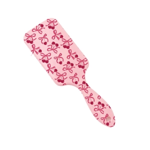 Pink hair brush with cute cherry and bow print, featuring detangling paddle massage pins