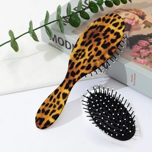Detail of leopard print hairbrush set with massage air cushion and nylon bristles